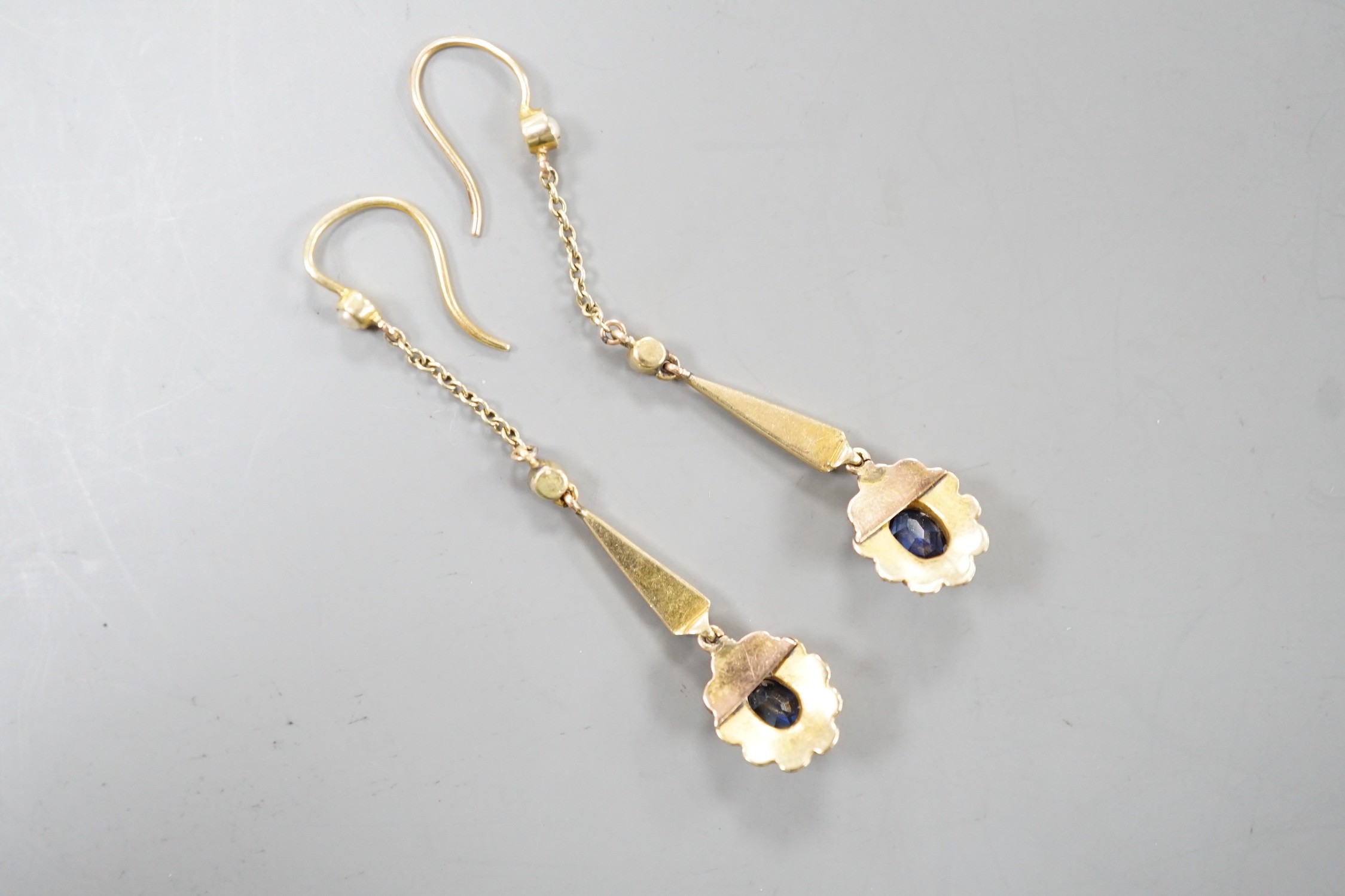 A pair of yellow metal, sapphire and seed pearl set drop earrings. 41mm, gross weight 3.4 grams.